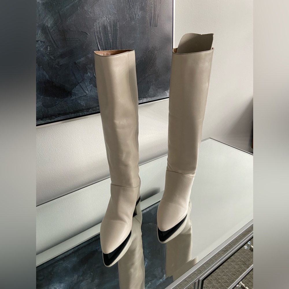 Off white boots worn once indoors.